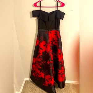 Gorgeous dress with a classic off shoulder , floral print on a satin skirt.